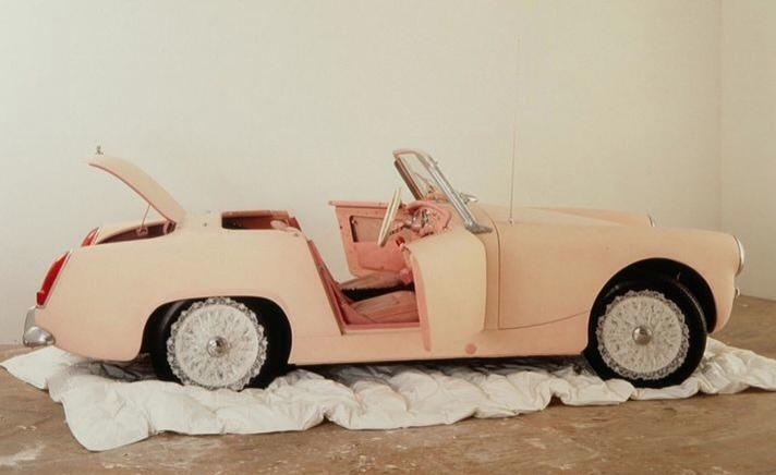a pink midget MG convertible