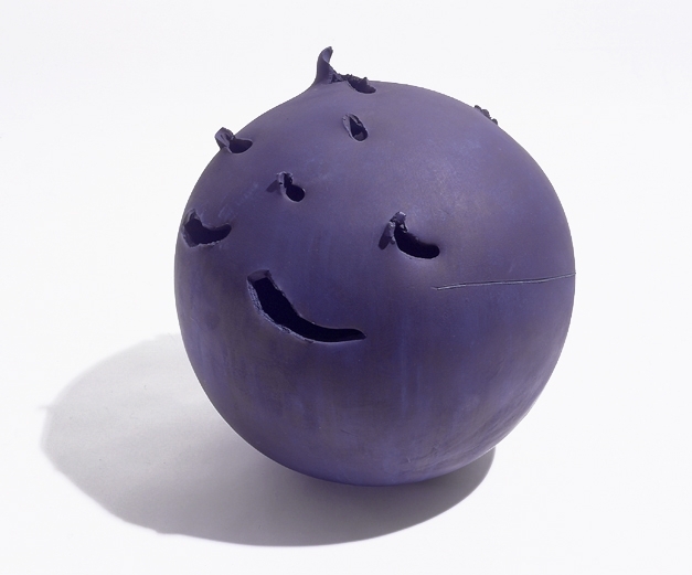 spherical purple ceramic sculpture with irregular perforations