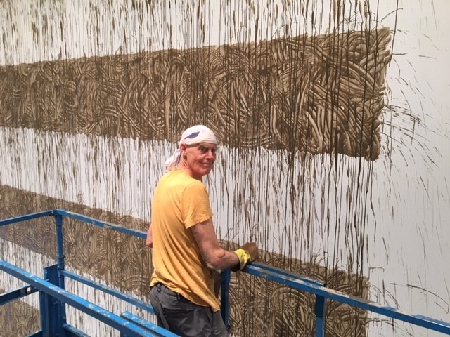Richard Long installing Heaven, 2020, River avon mud, 345 3/16 x 450 3/16 inches.