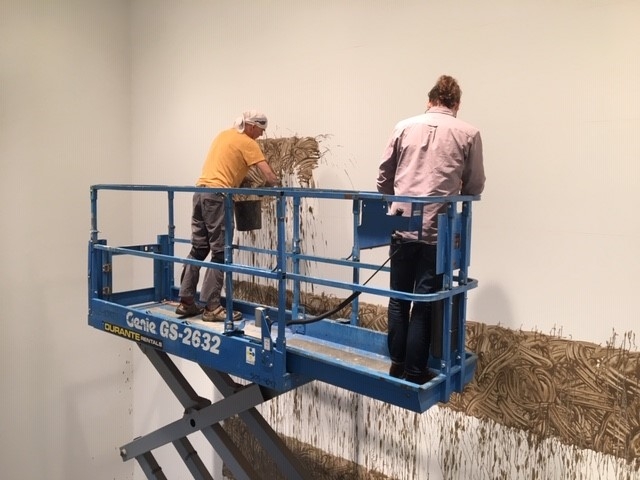 Richard Long installing Heaven, 2020, River avon mud, 345 3/16 x 450 3/16 inches., Photograph &copy; Denise Hooker, 2020.